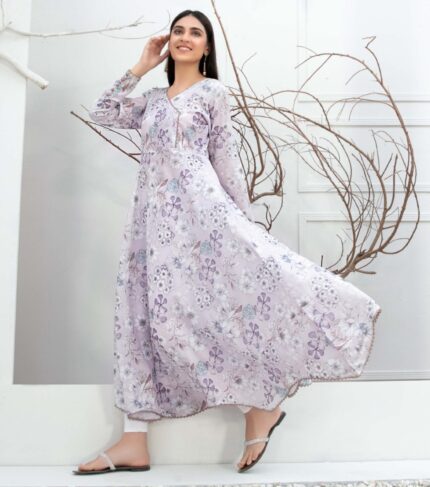 A graceful model wearing an Enchanting Pink Floral Swiss Digital Print Dress, embodying elegance and charm. A perfect choice for those seeking a blend of floral beauty