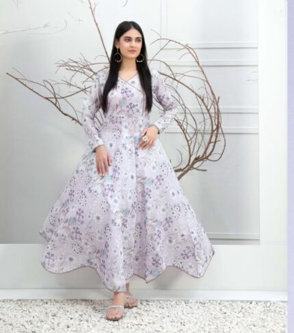 A graceful model wearing an Enchanting Pink Floral Swiss Digital Print Dress, embodying elegance and charm. A perfect choice for those seeking a blend of floral beauty